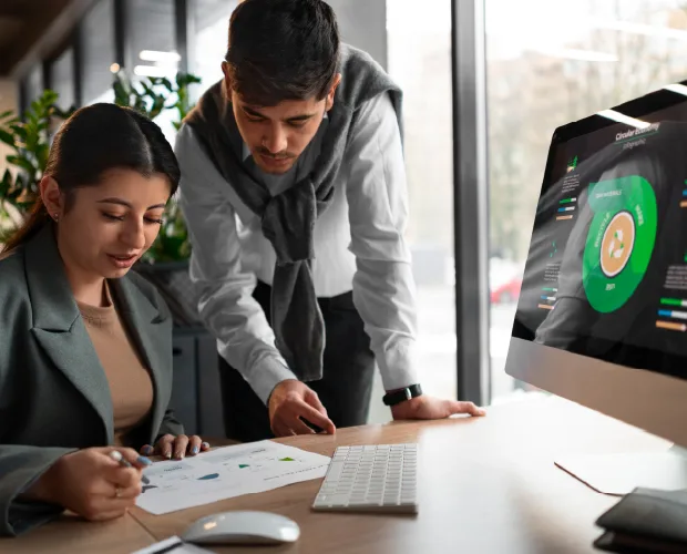 Students analyzing financial data at a computer, representing the Best Financial Accounting Institute in India.